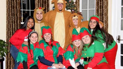 Rivier students in Christmas costumes
