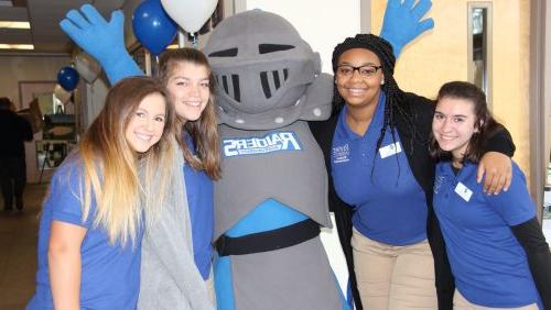 Rivier student group with Raider mascot